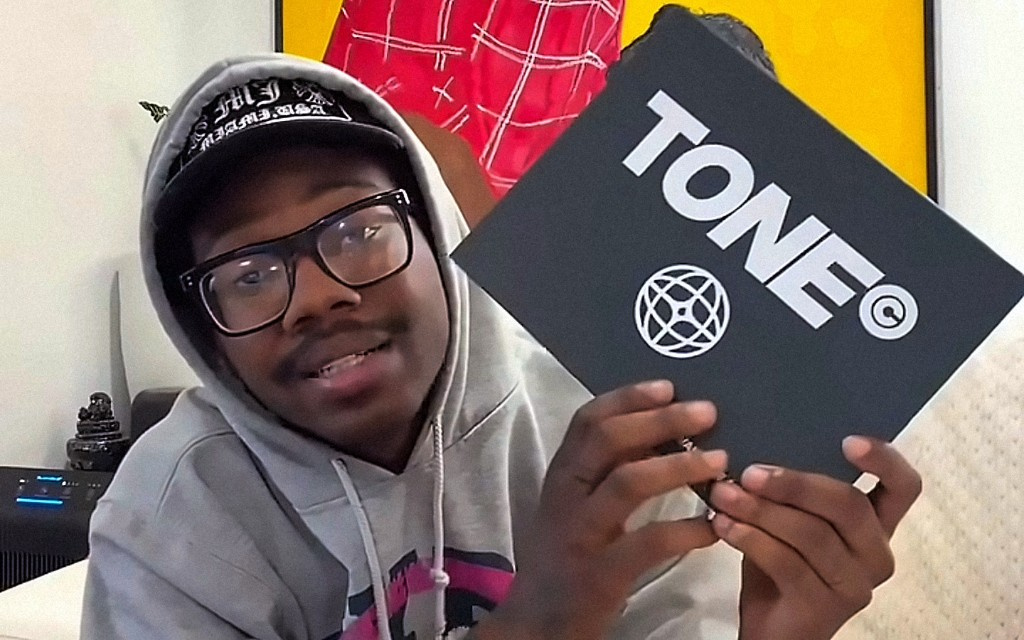 Creator unboxing a TONE product
